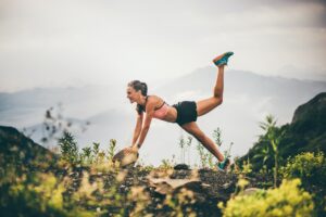 Fitness woman doing exercises in nature.