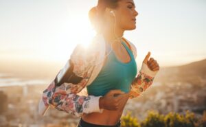 Fitness woman running outdoors